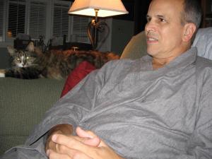 "Those glowing eyes have magic healing powers," Dad wrote in his email, to which this post-procedure recovery photo was attached. That was his first surgery, in September of '06. And yes, the cat is Delilah.